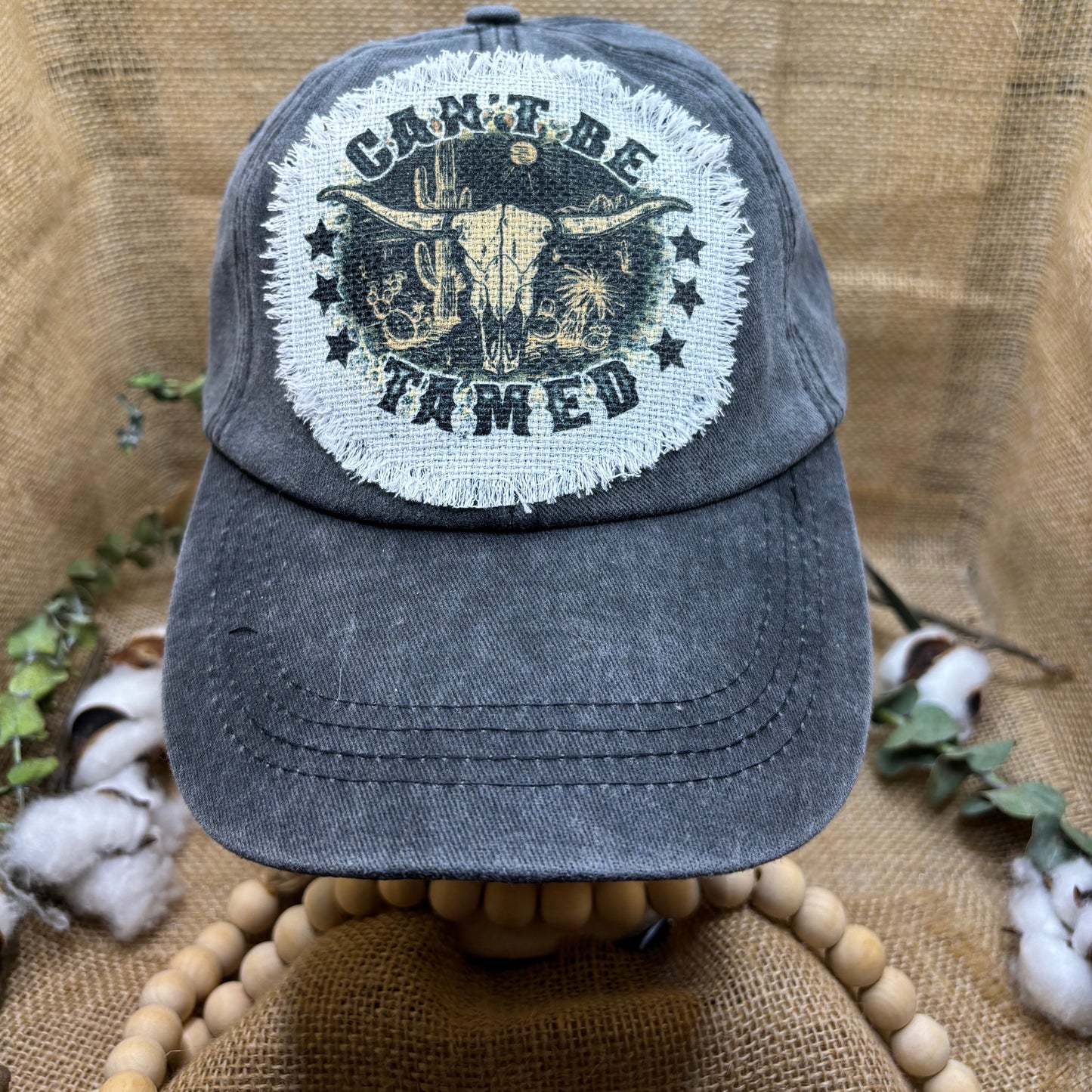 Can't Be Tamed Distressed Patch Ponytail Hat