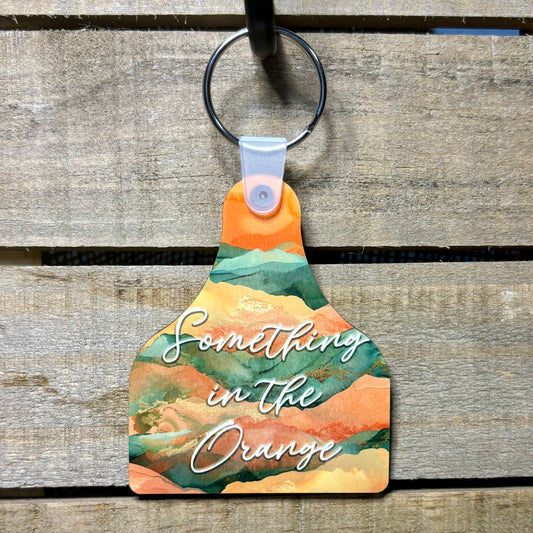 Something in the Orange Cow Tag Keychain